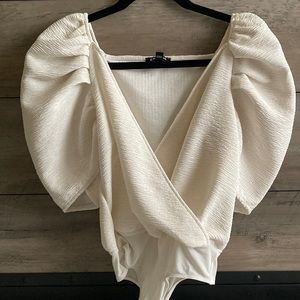 Cream body suit puff sleeves